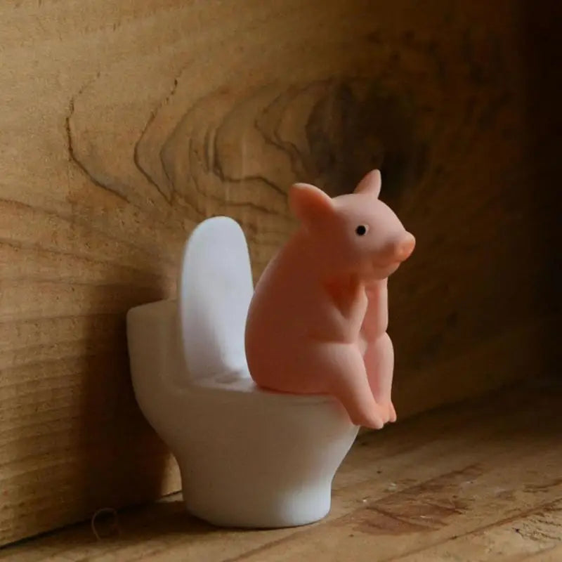 Cute Cartoon Piggy Figurine: Sitting Toilet Desktop Ornament for Fun Decor