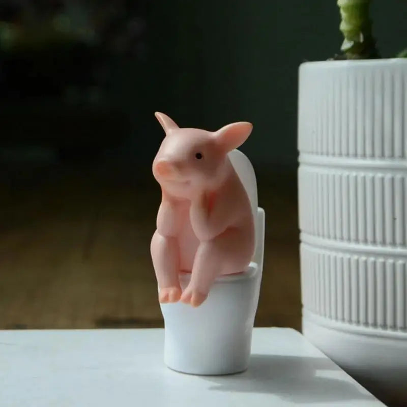 Cute Cartoon Piggy Figurine: Sitting Toilet Desktop Ornament for Fun Decor